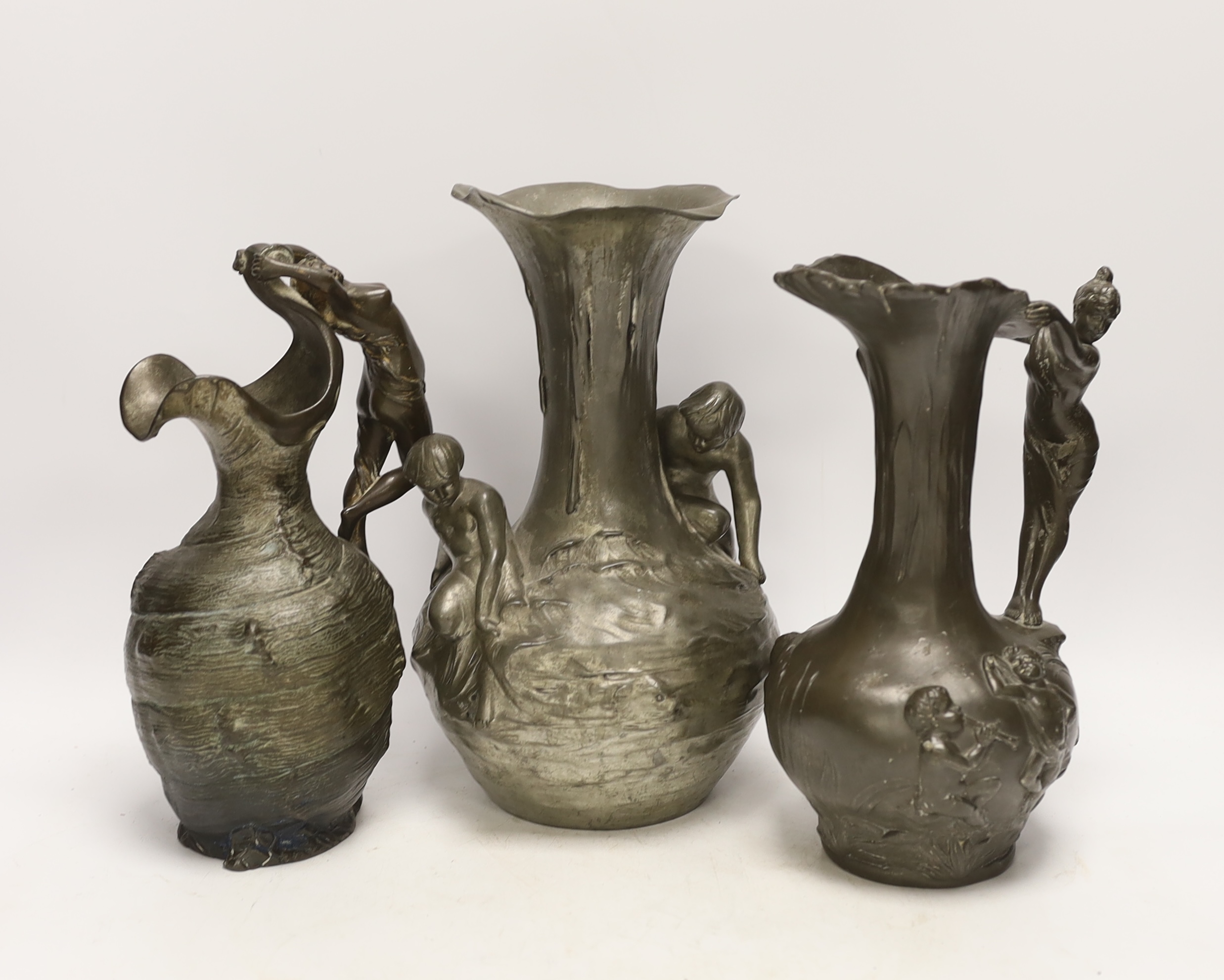 An Art Nouveau Kayserzinn pewter vase and two similar Etan Garanti pewter ewers, signed ‘H. Huppe’ and ‘Petiz’, tallest 27cm